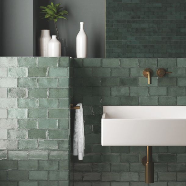 sage green glossy metro tiles with handmade effect finish in a modern bathroom.