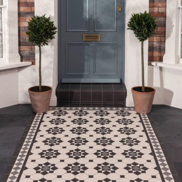 Outdoor pathway geometric black and white Victorian design tiles 