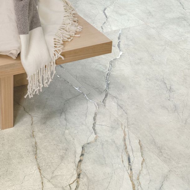 Marble effect porcelain floor tiles with natural tones and veins